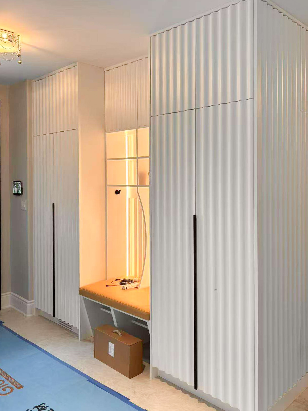 custom millwork-entrance with hidden door-MDF slat door profile paintin
